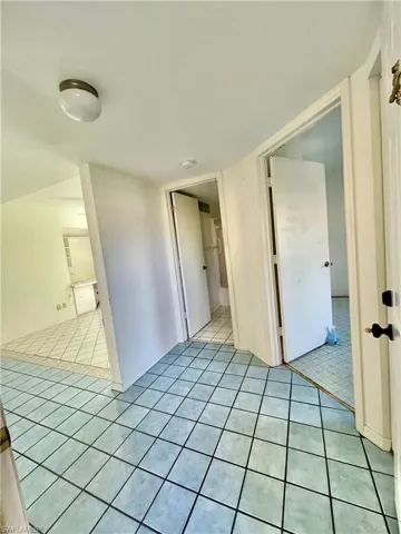 Spare room featuring light tile floors