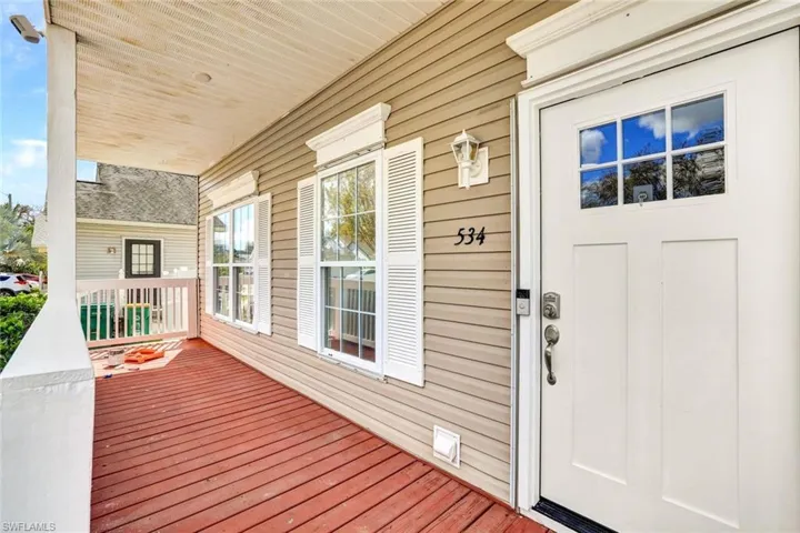 Entrance to property featuring a porch