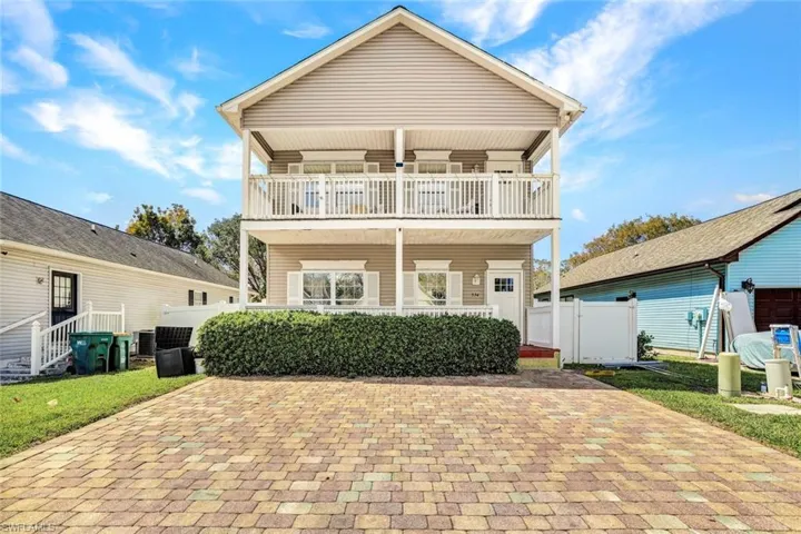 View of front of home with a balcony