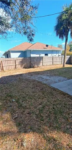 View of fenced backyard