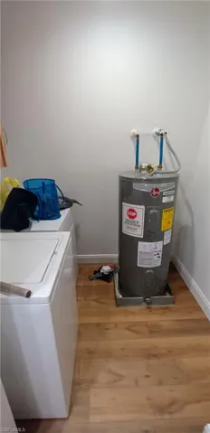 Laundry area featuring washer / dryer, downstairs