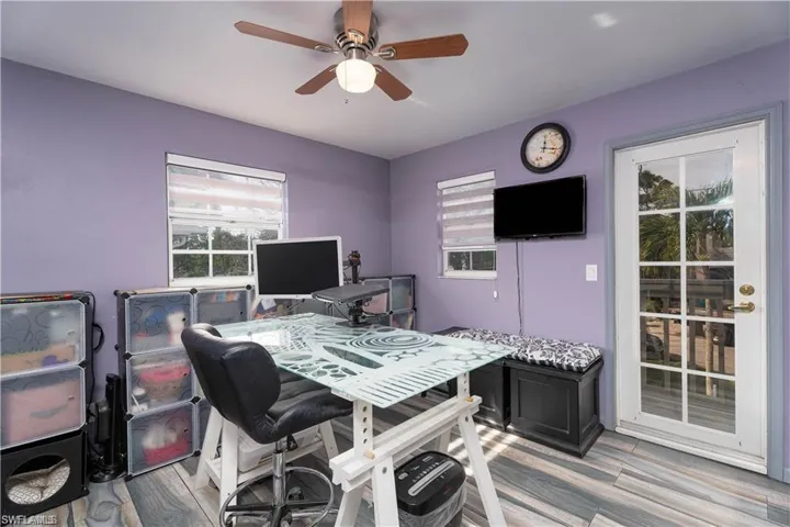 Office area featuring light hardwood / wood-style floors and ceiling fan