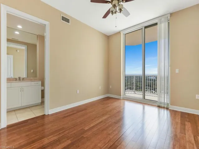 Guest bedroom w/ en suite bath & private balcony offering river & city views!