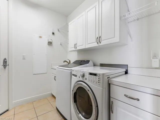 Laundry w/ access to storage room & private vestibule