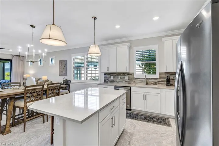 Upgraded lighting, plantation shutters, trim work throughout.