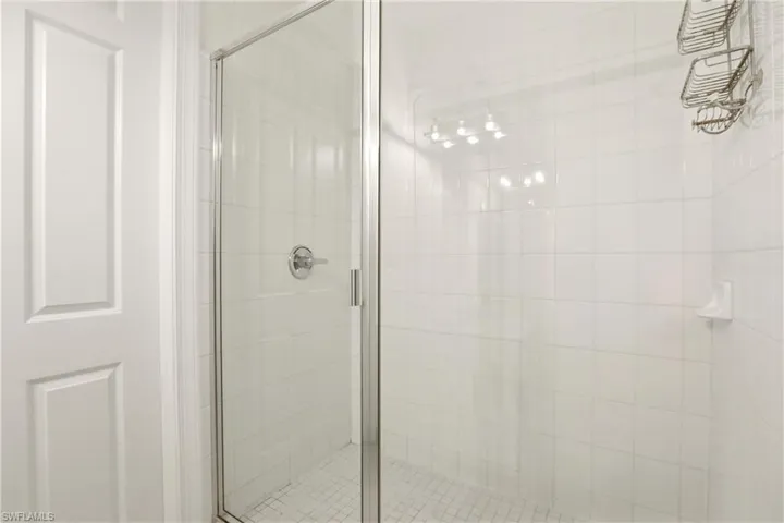 Full bath with a shower stall