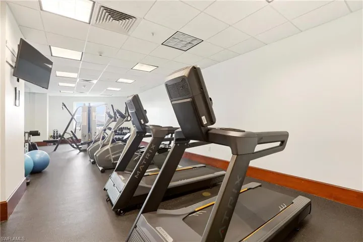 Exercise room featuring a drop ceiling