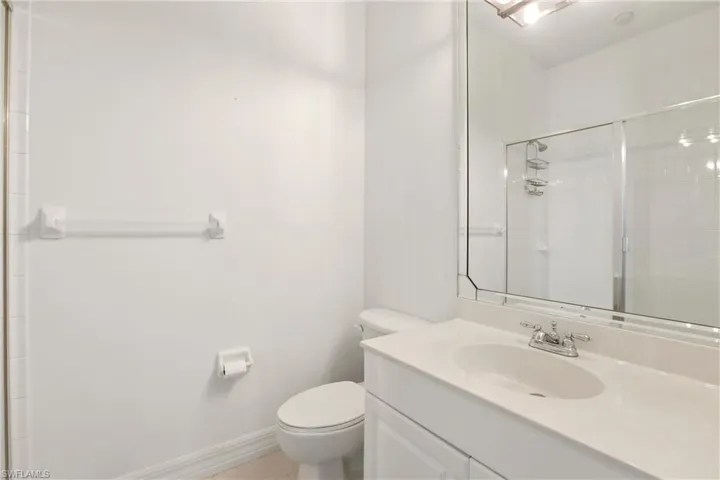 Bathroom featuring vanity and a stall shower