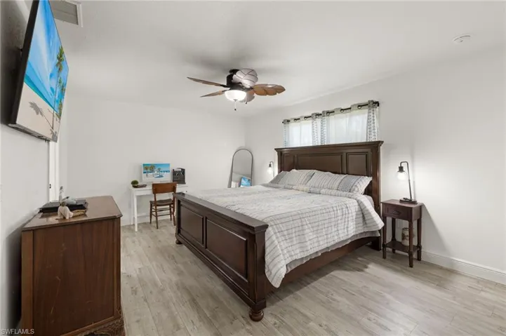 Bedroom with light wood-type flooring and ceiling fan