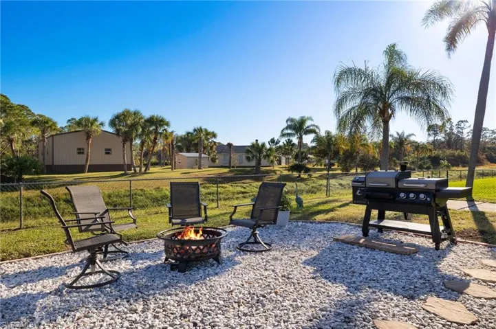 View of yard with a fire pit