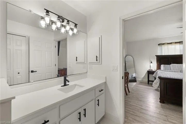 Bathroom featuring vanity and hardwood / wood-style floors