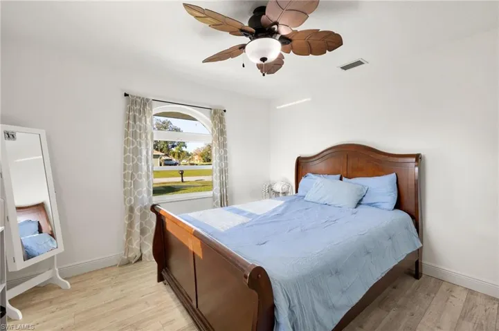 Bedroom featuring light hardwood / wood-style floors and ceiling fan
