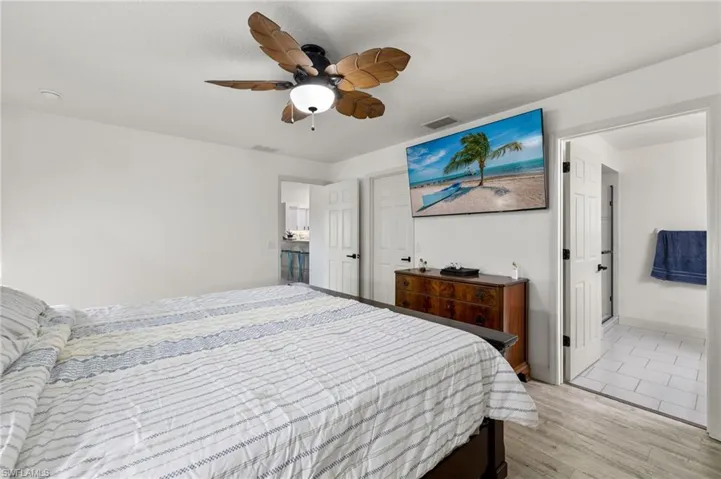 Bedroom with light wood-type flooring and ceiling fan