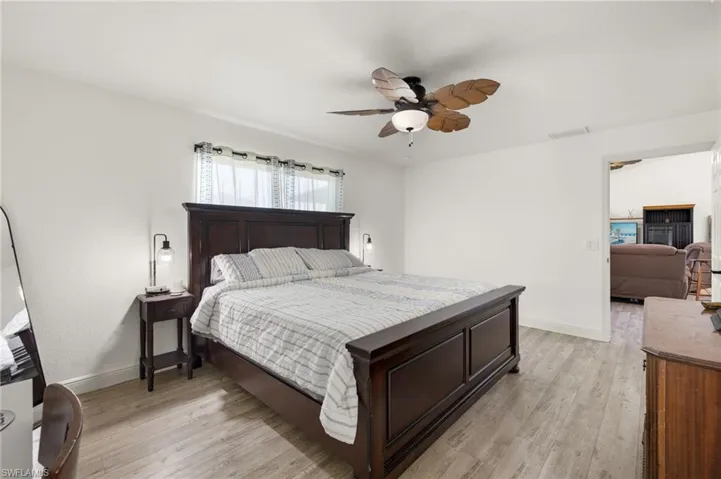 Bedroom with light wood-type flooring and ceiling fan