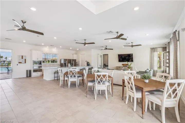 Dining area with light tile patterned flooring