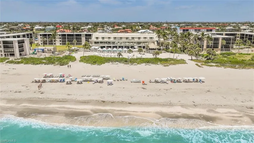 Bird's eye view of waterfront with a beach