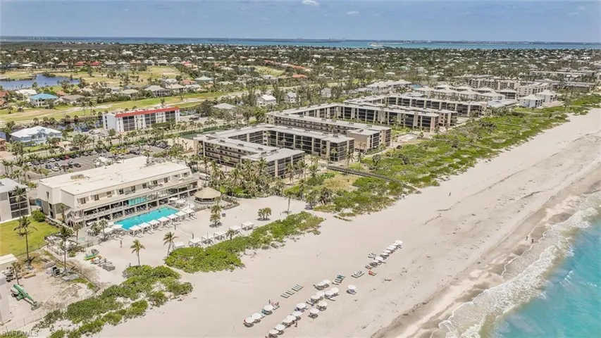 Bird's eye view of extended coastline and a pool area