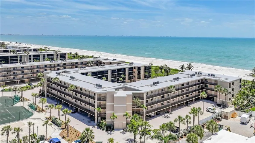 Bird's eye view of apartment complex / building and unending shoreline