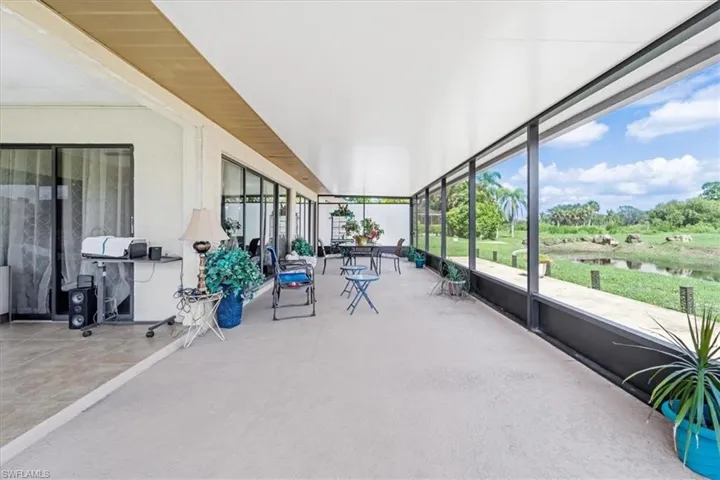 Unfurnished sunroom featuring a water view