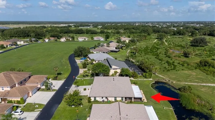 View of property location featuring nearby suburban area and a large body of water