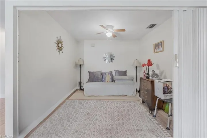 Bedroom featuring light wood-style flooring and a ceiling fan