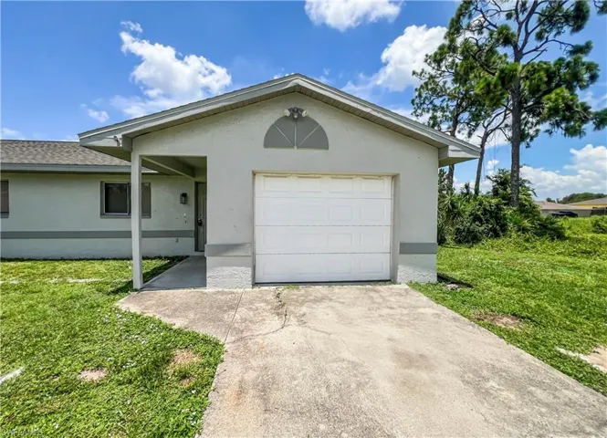 Attached single-car garage and a covered entry
