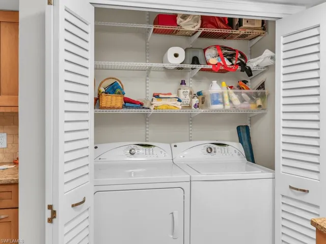 Clothes washing area with washer and clothes dryer
