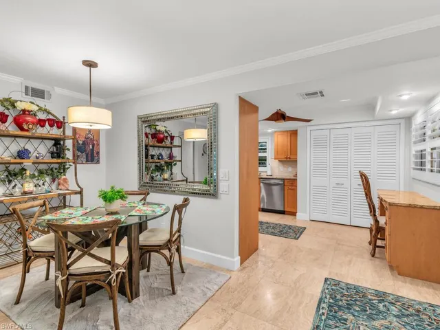 Tiled dining room with crown molding