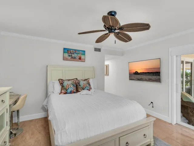 Bedroom featuring crown molding and ceiling fan