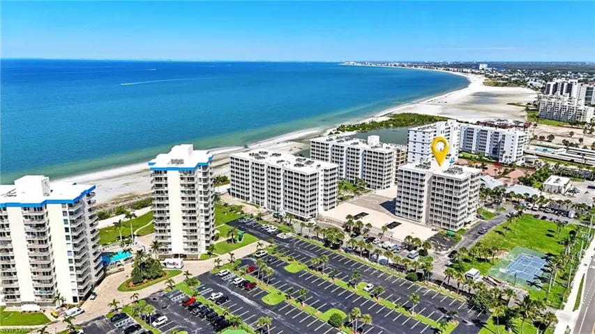 Drone / aerial view of condominium complex / building and extended coastline - Virtually Edited Image