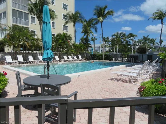 Community pool with a patio area