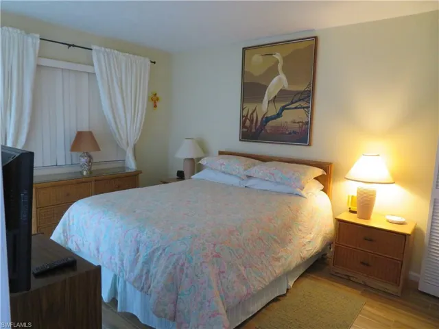 Bedroom with wood finished floors