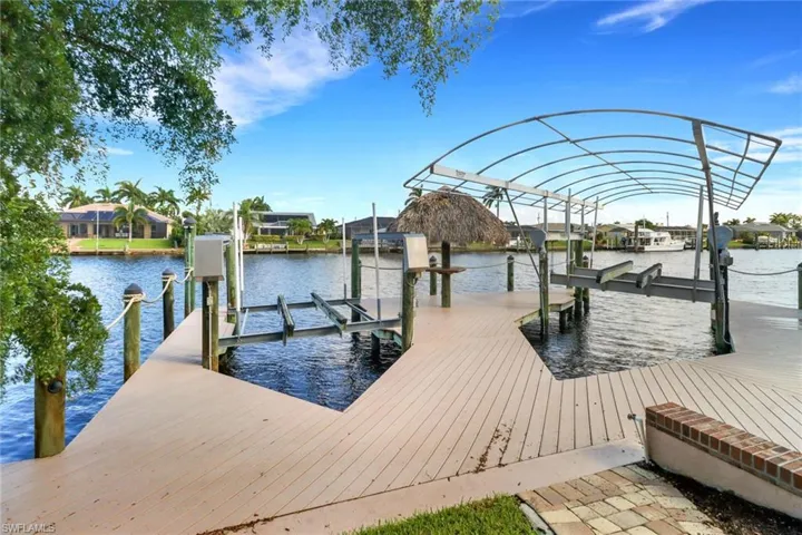 Dock area featuring a water view