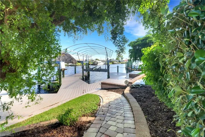 Dock area featuring a water view