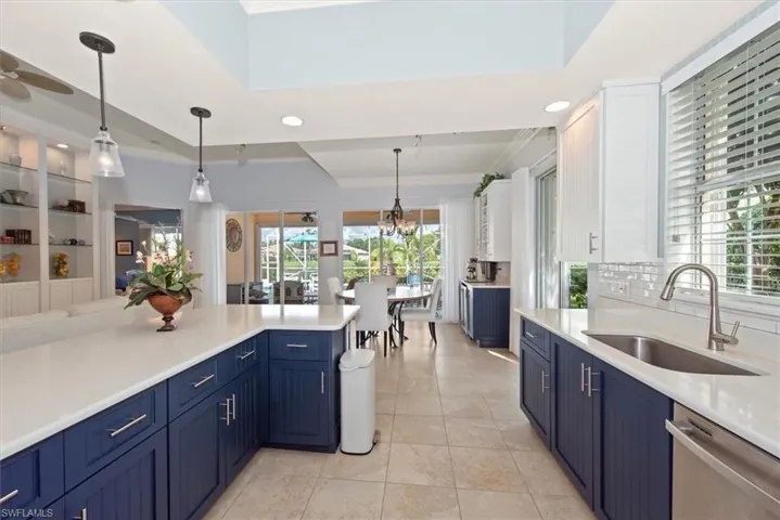 Newer high end kitchen, Quartz counter top, wood cabinetry with matching server built in and wine chiller at dining are 2021