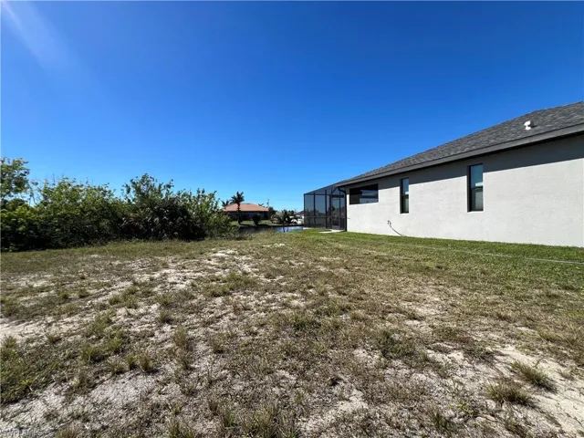 View of yard with a lanai