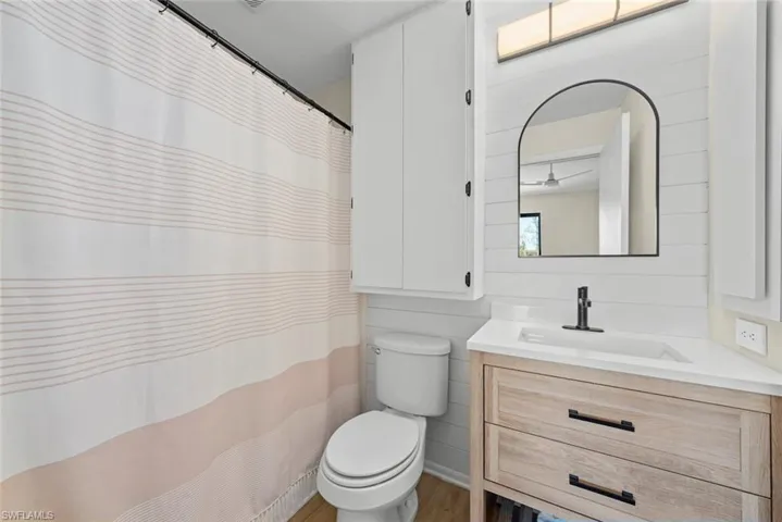 Full bath featuring toilet and vanity