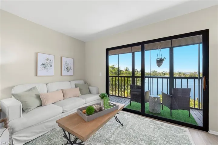 Living area with a water view and light wood-style flooring
