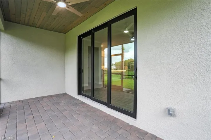 View of patio featuring ceiling fan