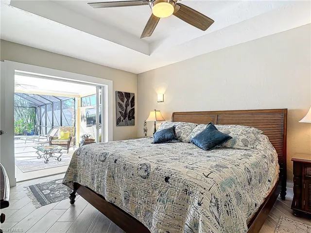 Ensuite with sitting area.  Views of the pool and canal! Crown molding