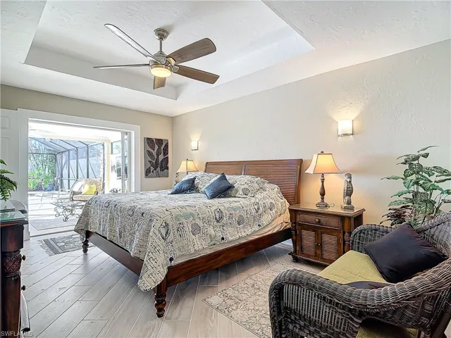 Ensuite with sitting area.  Views of the pool and canal! Crown molding