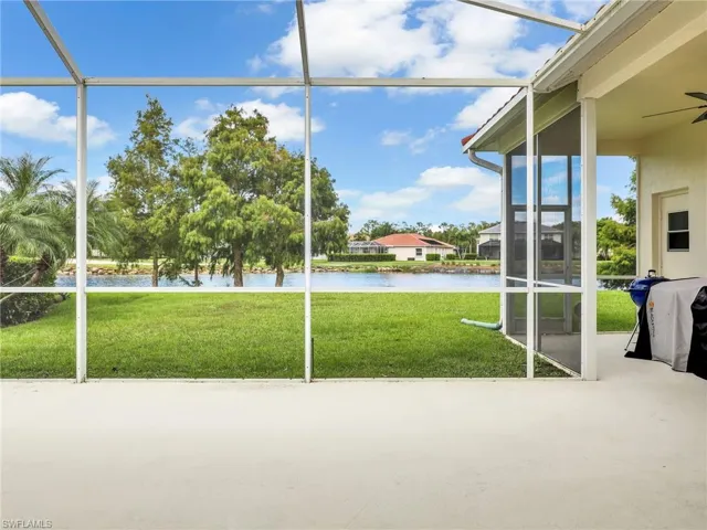 Extended L Shaped Screened in Lanai with Ceiling Fan, and Lake and Golf Course Views