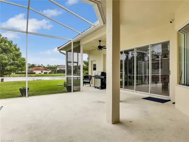 Extended L Shaped Screened in Lanai with Ceiling Fan, and Lake and Golf Course Views