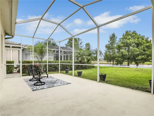 Extended L Shaped Screened in Lanai with Ceiling Fan, and Lake and Golf Course Views