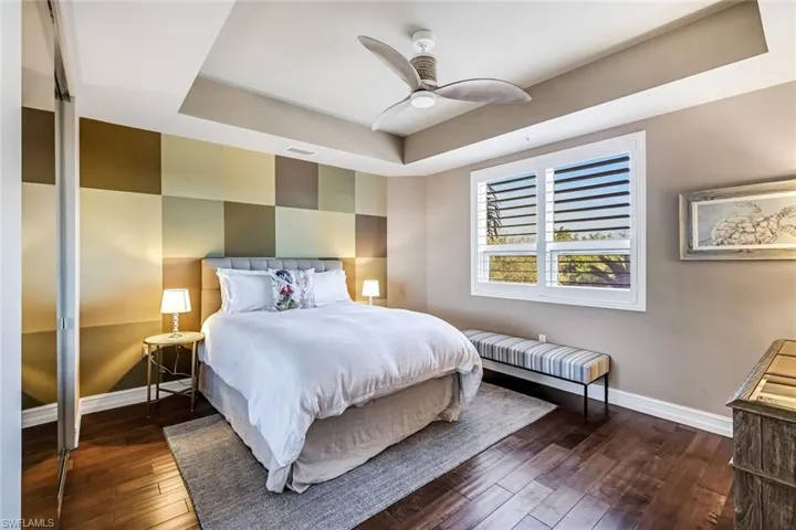 Guest Bedroom with Wood Flooring