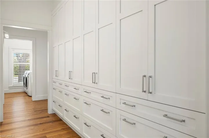 Primary closet featuring washer and clothes dryer