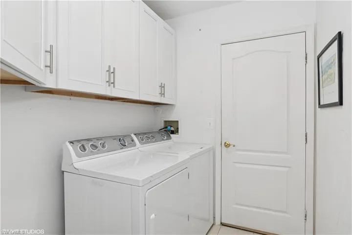 Laundry room with cabinet space and independent washer and dryer