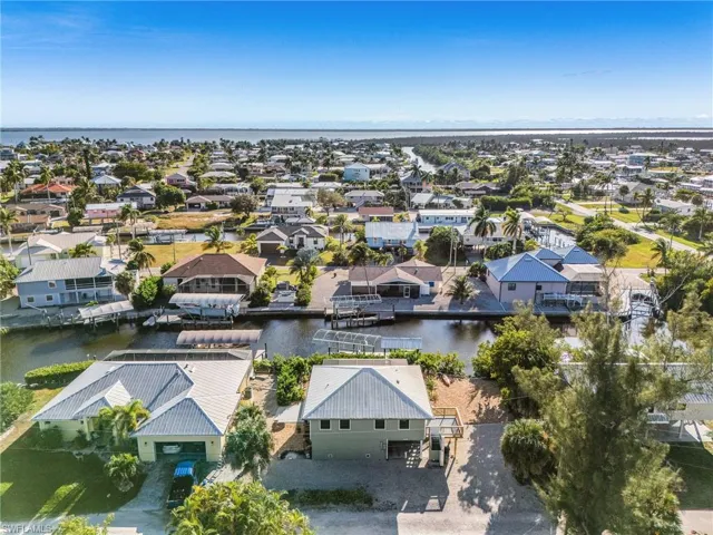 Aerial view of residential area with a large body of water