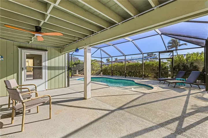 Swimming pool featuring a patio area, and a lanai