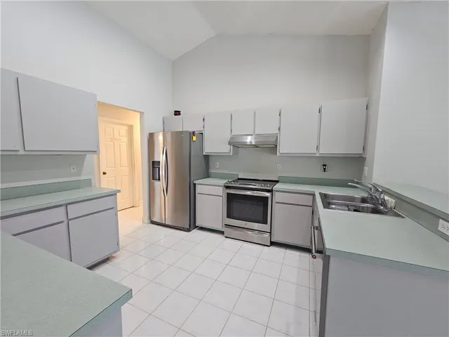 Large kitchen with stainless steel appliances